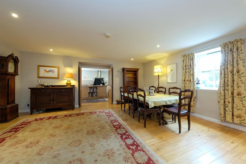 Double doors in the kitchen lead to a very spacious dining room which has a lot of potential.