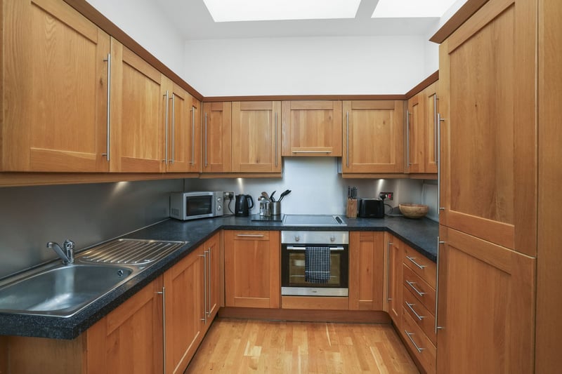 The kitchen is modern and well-equipped with plenty of storage space.