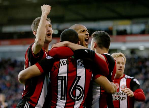 Leon Clarke (C) of Sheffield United celebrates scoring with teamates during the Sky Bet Championship match between Sheffield United and Hull City at Bramall Lane on November 4, 2017 in Sheffield, England. (Photo by Nigel Roddis/Getty Images)