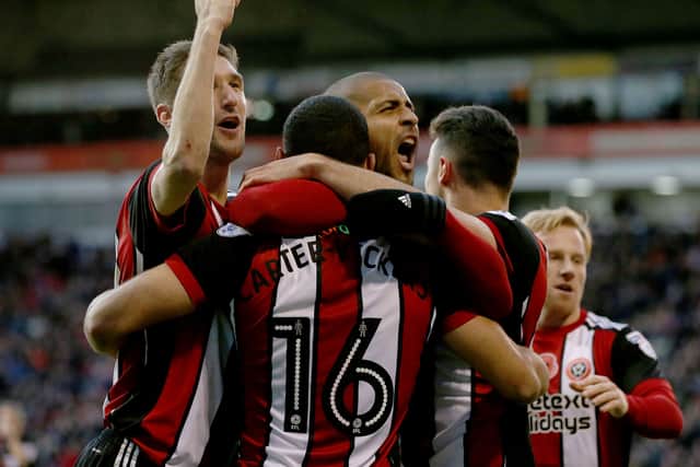 Leon Clarke (C) of Sheffield United celebrates scoring with teamates during the Sky Bet Championship match between Sheffield United and Hull City at Bramall Lane on November 4, 2017 in Sheffield, England. (Photo by Nigel Roddis/Getty Images)