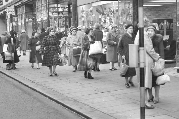 You've done the shopping. Now it's time for a chat outside Woolworths in Fawcett Street in December 1960.