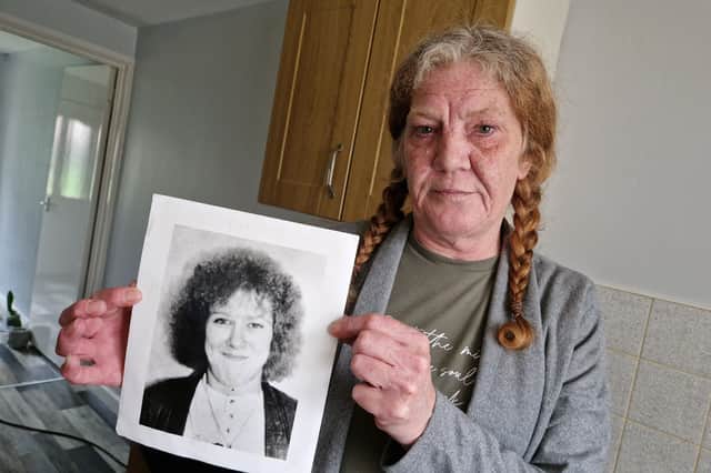 Mandy Shields, from Sheffield, pictured with a photo of sister Dawn, who was murdered in 1994