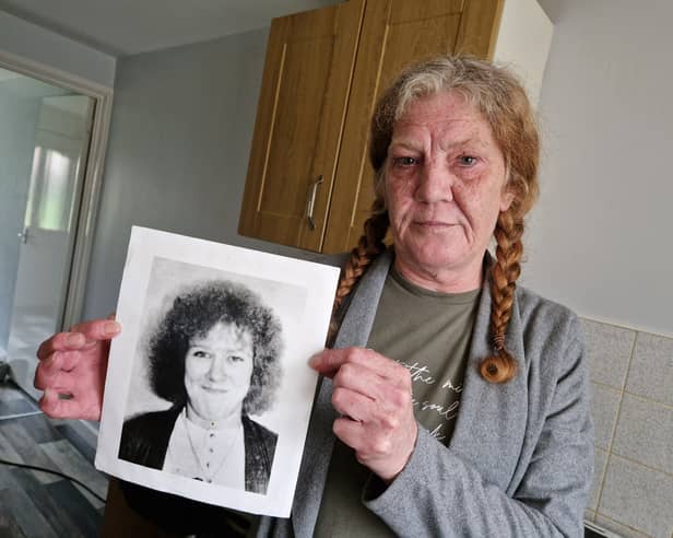Mandy Shields, from Sheffield, pictured with a photo of her sister, Dawn, who was murdered in 1994. Mandy wants police to re-open the murder investigation and start again to find Dawn's killer. Photo: David Kessen, National World