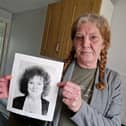 Mandy Shields, from Sheffield, pictured with a photo of her sister, Dawn, who was murdered in 1994. Mandy wants police to re-open the murder investigation and start again to find Dawn's killer. Photo: David Kessen, National World