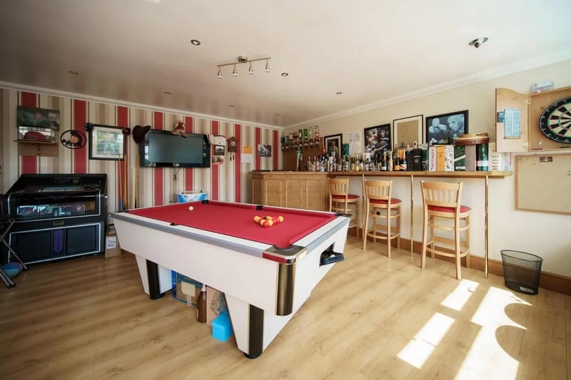 This a bar and games room could also be utilised as a sixth bedroom.