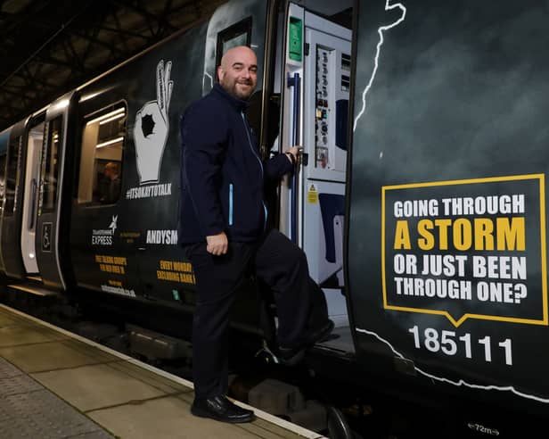 Ian Watson boards the newly wrapped train for its inaugural journey.