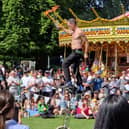 An entertainer juggled with fire sticks while on a unicycle at the Sheffield May Fayre at Weston Park, Sheffield. Photo: David Kessen, National World