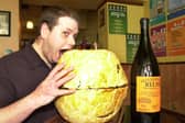 Stone House manager/chef Paul Kemp samples one of the footie pies ready for the world cup matches on May 20, 2002