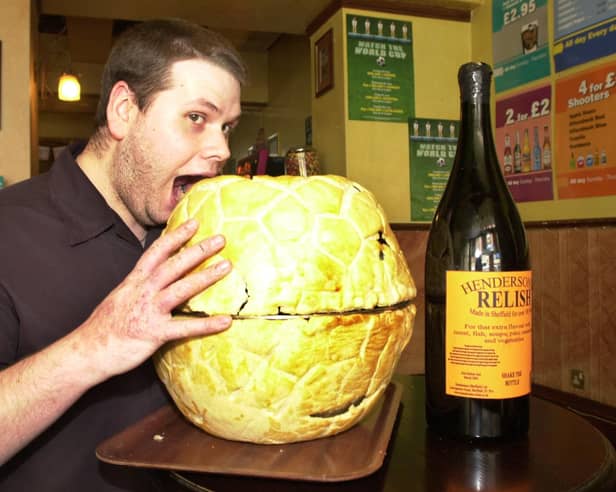 Stone House manager/chef Paul Kemp samples one of the footie pies ready for the world cup matches on May 20, 2002