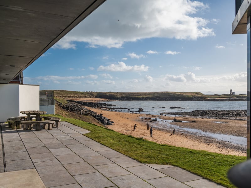 Mid Rock House is an award-winning south facing contemporary home in a prime situation overlooking Ruby Bay in Elie, Fife.