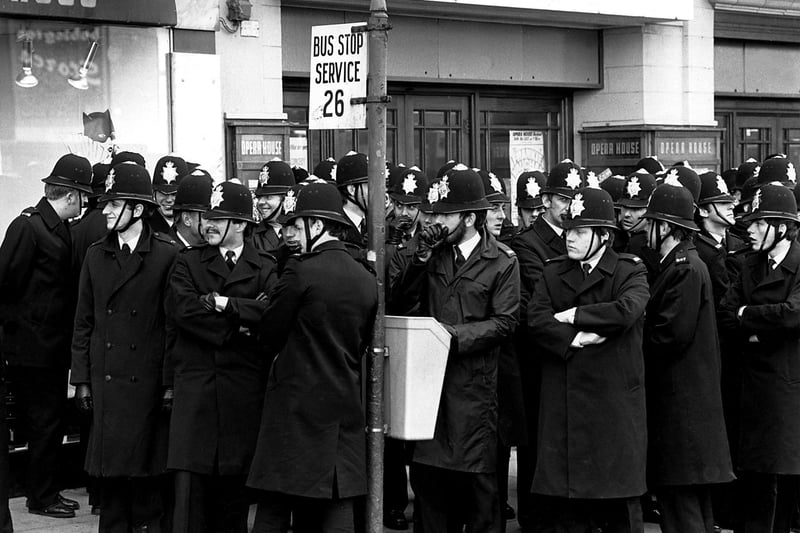 Policemen waiting to be picked up, outside Blackpool's Winter Gardens for one of the party conferences