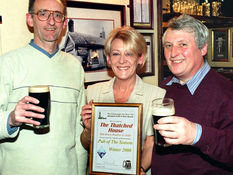 Valerie Ballentine of the Thatched House receives the CAMRA "Pub of the season-Winter 2000" award from CAMRA branch chairman Ian Ward (left) and CAMRA Regional Organiser Ray Jackson
