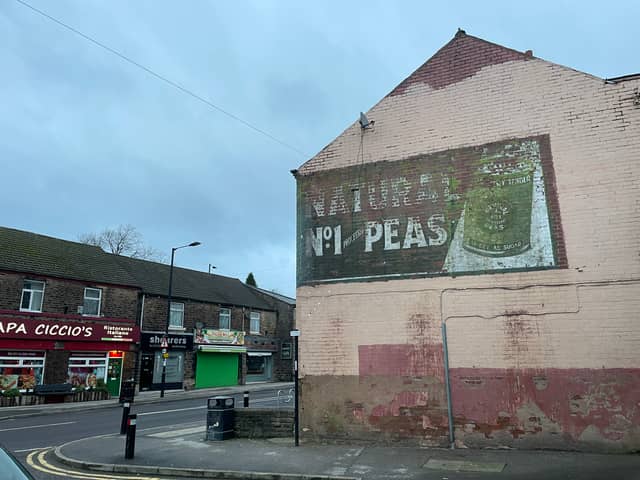 This painted sign advertising processed peas was revealed when a billboard was removed from the side of the building on Sandygate Road, Sheffield. It remains in surprisingly good condition, with the pea green colouring still fairly vibrant.