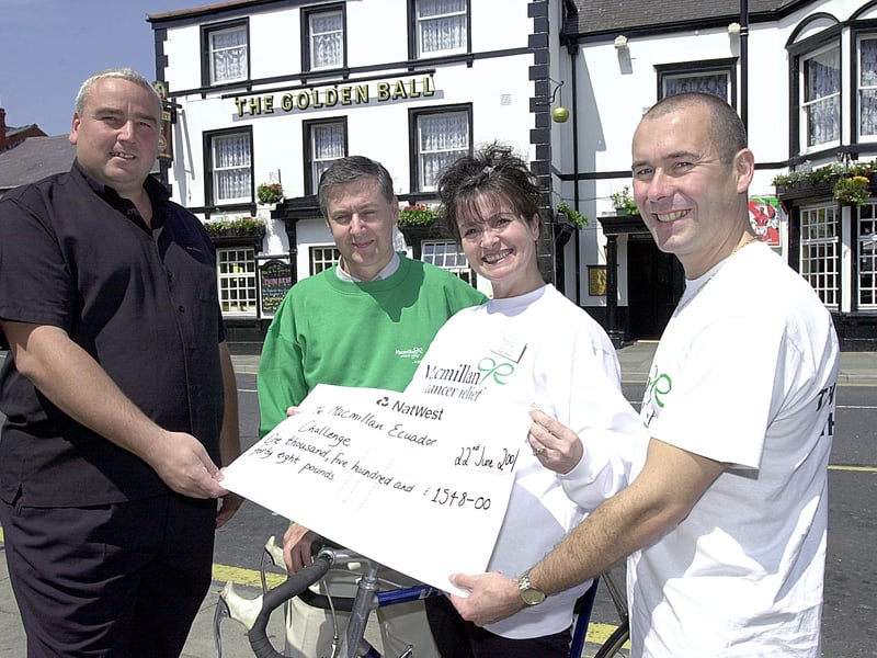 Keith Jones, landlord of the Golden Ball, Poulton, presents £1,500 raised at a fundraising evening at the pub.