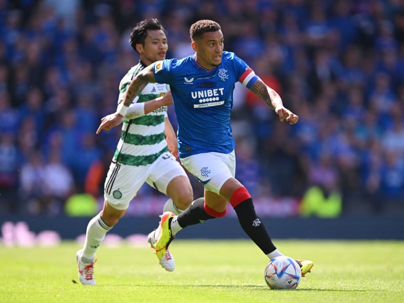 Rangers' Tavernier and Celtic's Hatate vie for the ball.