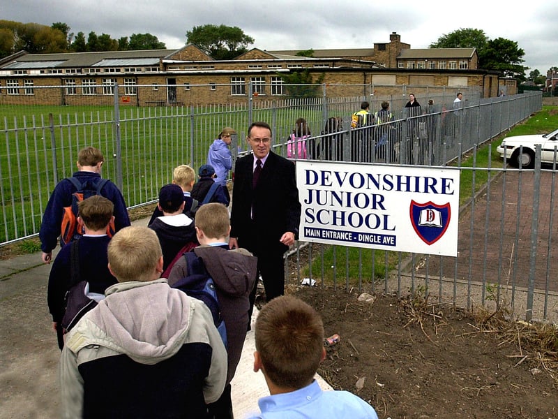 Devonshire Junior School (Blackpool) pupils arriving at their temporary School at Grange Park, being welcomed by head teacher Neil Hodgkins