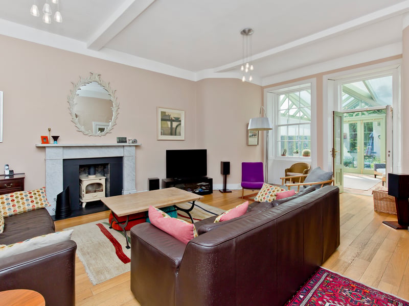 It features bright and expansive rooms, with high ceilings and period details – all lovingly decorated in light neutral hues.
