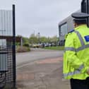 Picture shows a police officer guarding the school's main gate this morning at Birley Academy, on Birley Lane on May 1, following an incident which left three injured 
