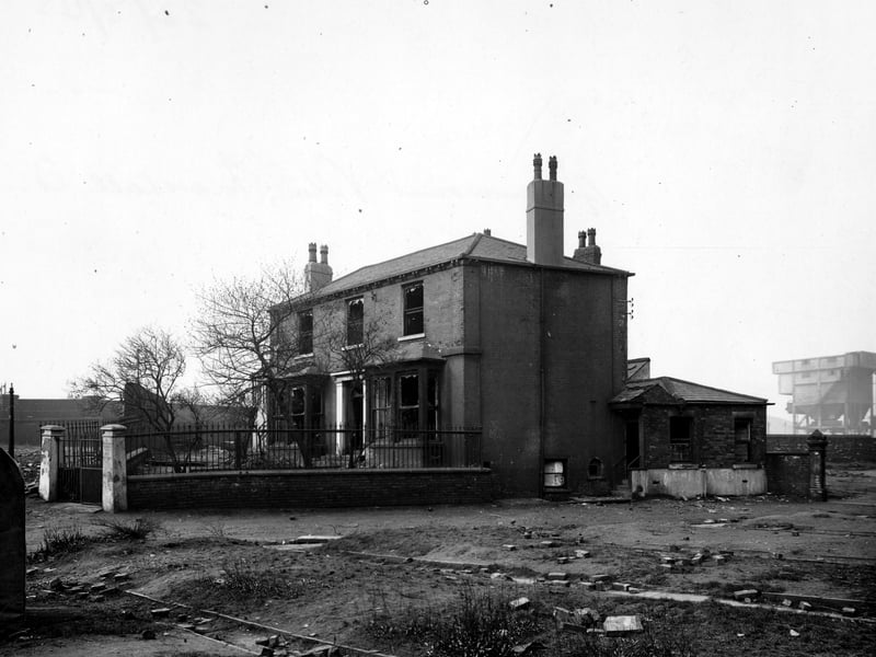 Greenmount Villa, a large detached derelict house on Marshall Street. A strange building can be seen in the background to the right. Pictured in March 1945.