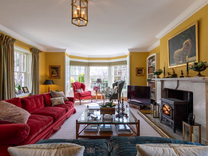 The large bay window ensure the living space is well lit while the log-burning stove keeps it cosy.