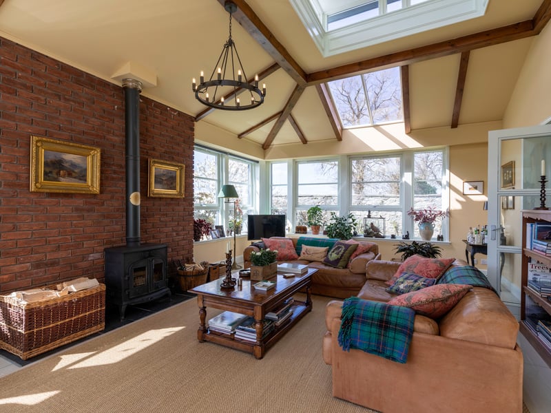 The garden room brings in plenty of light and has views over the gorgeous gardens.