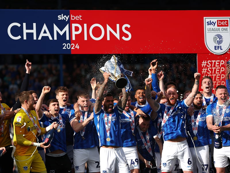 Marlon Pack lifts the League One trophy against Wigan.