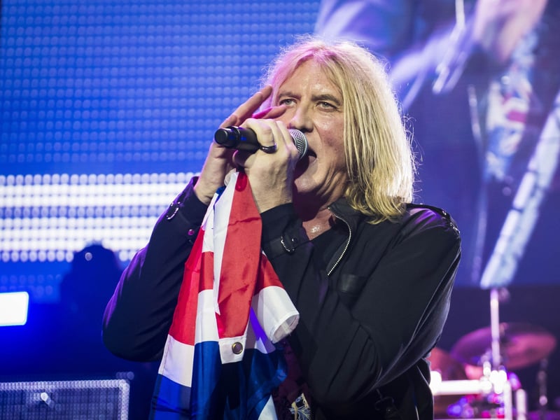 When Joe Elliott first met Pete Willis, he initially asked if Willis' new band, Atomic Mass, which included drummer Tony Kenning and bassist Rick Savage, needed another guitarist. He was told it didn't but they were looking for a singer. Despite never having sung outside the shower, Elliott volunteered to fill the role and the rest is history.