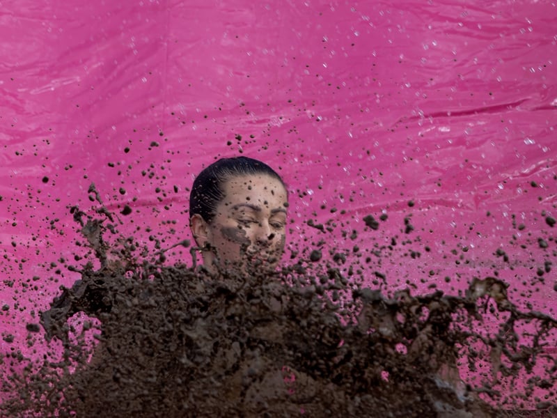 Participants climbed, crawled and slid their way around the Pretty Muddy obstacle course at their own pace.