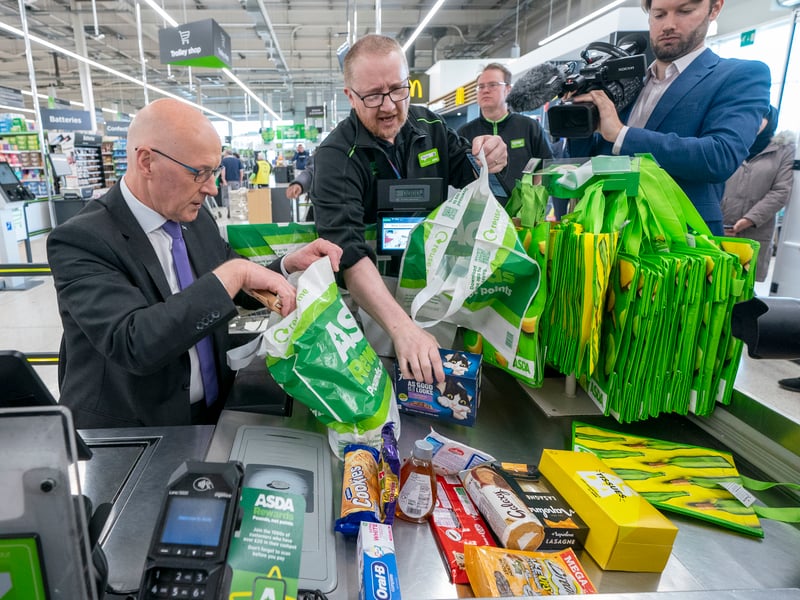 Scottish First Minister John Swinney helped out on the check-out when he visited Asda at Chesser on Wednesday, while on the campaign trail with Edinburgh South West SNP candidate Joanna Cherry.  