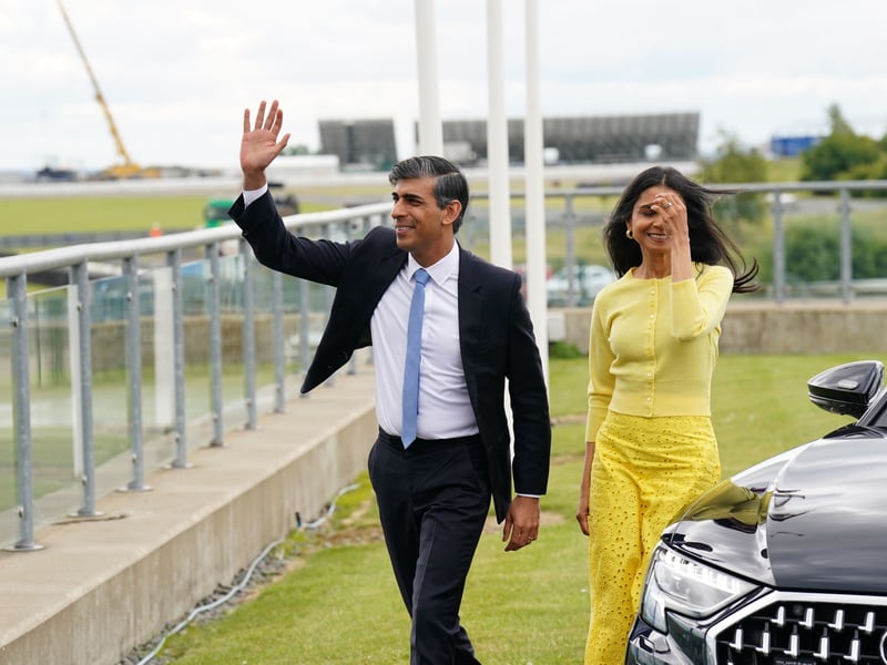 The Conservatives chose Silverstone motor racing circuit for the launch of their manifesto on Tuesday.  But Rishi Sunak arrived with his wife Akshata Murty in a shiny black Audi rather than a roaring F1 racing car.
The manifesto pledged to cut National Insurance by another 2p and scrap it for the self-employed, financed mainly by benefit cuts. There was also a promise to deport 90,000 migrants,. 

