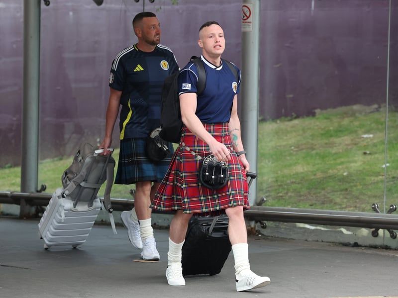 Two Scotland fans pictured leaving Edinburgh Airport.