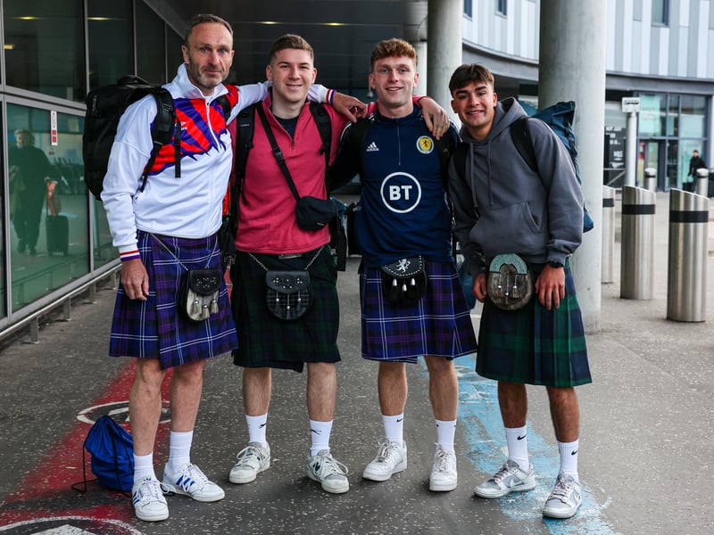 These four Scotland fans get ready to depart Edinburgh Airport all kilted up!