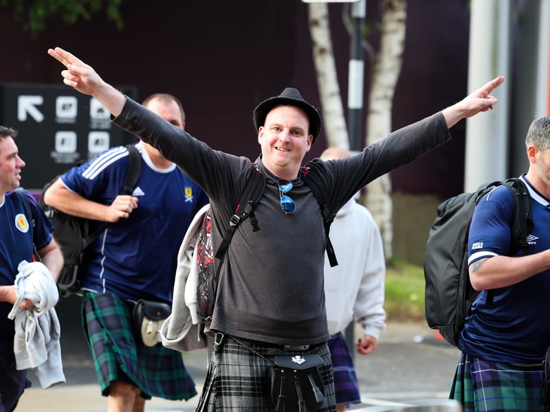 Is this Scotland fan mimicking an aeroplane? Someone is desperate to get to Germany!