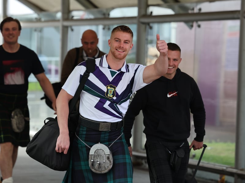 More Scotland fans make their way to the departure lounge.