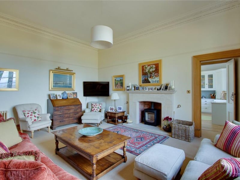 Baldowrie’s bright and airy hallway leads to a drawing room with a log-burner, set within a large fire surround, as well as a formal dining room with plenty of space for entertaining.