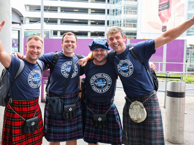 Scotland fans get ready to depart Edinburgh Airport.