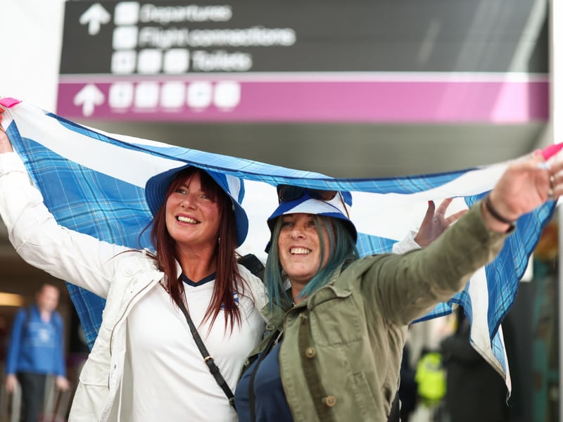 The weather forecast for Germany isn't great - but these fans have a big flag to protect them!