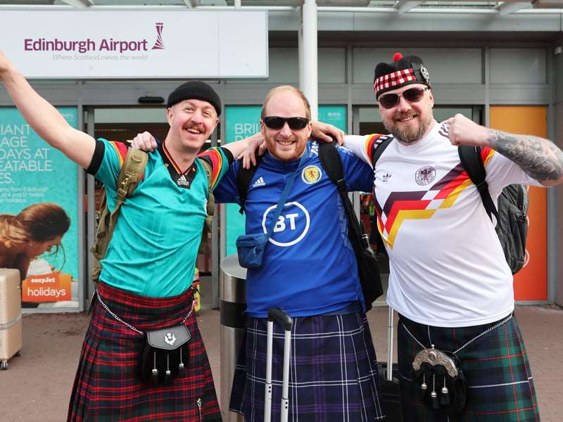The man is middle definitely didn't get the retro Germany shirt memo!
