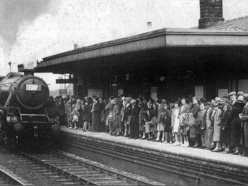 A crowd of people on the platform of Morley Top Station waiting for the train to Cleethorpes in 1937. 
