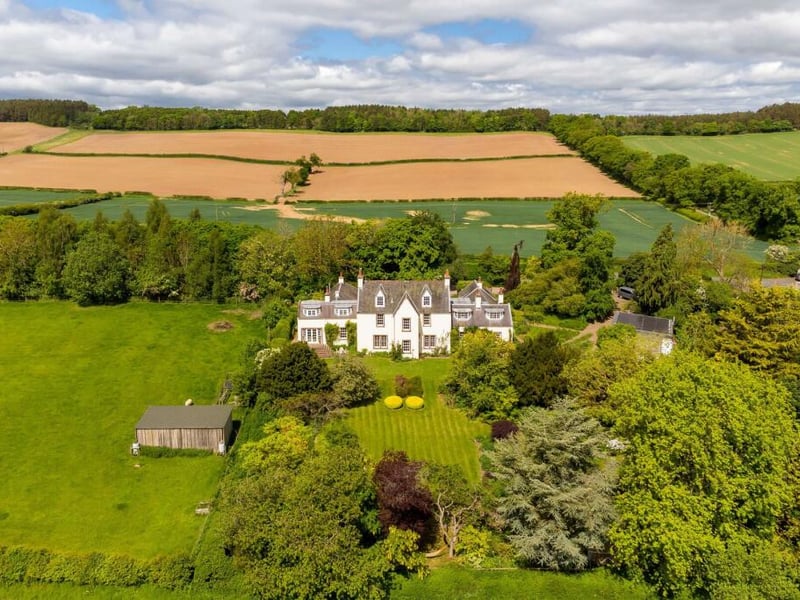 The summer house provides a distinctive focal point to the side of the property, with herbaceous planting softening the ground between it and the main house. It is a delightful garden with views across open county. A paddock is available to let, next to the house.