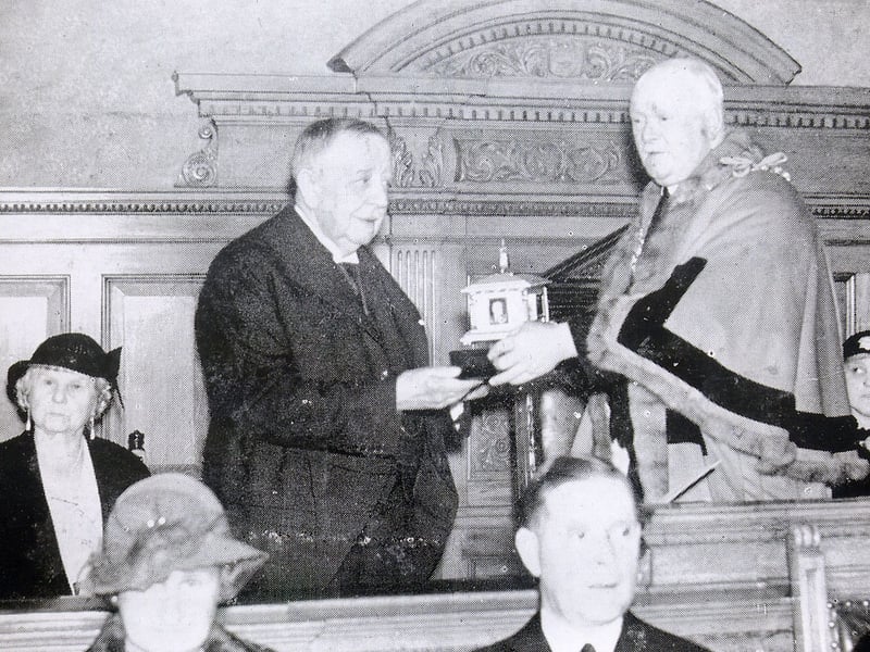 Alderman Willian Law Ingle receiving the casket holding the document granting him the Freedom of the Borough of Morley from the Mayor, Coun Harold Smith, in a ceremony at Morley Town Hall in August 1936.. Alderman Ingle, who had himself been Mayor of Morley in 1912-13 when a similar ceremony was held for Herbert Henry Asquith, lived at Morley Grange in Churwell and was the owner of Millshaw Leather Works.