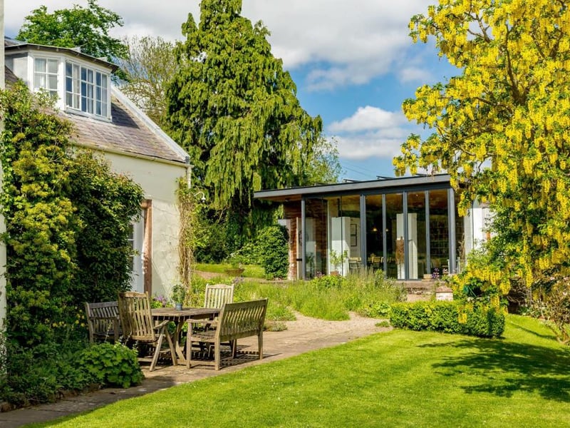 Accessed from the drive, or through the house, is a studio which could work well as a home office or artist's studio.