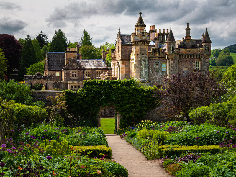 In the Scottish Borders, Abbotsford is the ancestral home of Sir Walter Scott. The Scots baronial mansion inspired other buildings like it and visitors can explore the historic house, which has been well preserved.