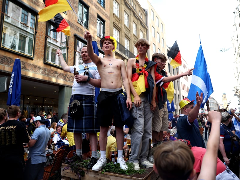 These fans don German colours in the Marienplatz.