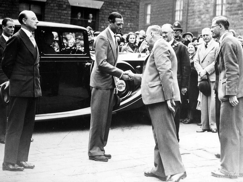 The Duke of Kent has arrived in Wesley Street on his royal visit to Morley in June 1939, where, as part of his itinery, he  visited the Morley Social Service Centre in Zoar Street. This provided activities and handicrafts for the unemployed, which was of particular value earlier in the 1930s when there was mass unemployment. The mayor of Morley, Alderman Alexander Wilson is part of the welcoming party and wears his chain of office, right centre.