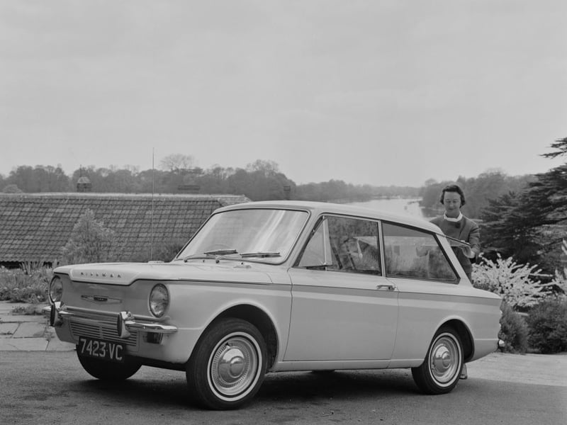 Rally driver Nancy Mitchell views the recently introduced Hillman Imp, a rear engine and rear wheel drive economy car, prior to a test drive in England on 2nd May 1963. The Imp was manufactured by the Rootes Group at their Linwood factory.