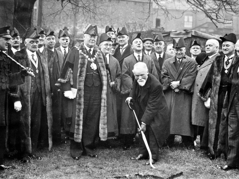 J.W. Hepworth cuts the first sod for the extension to Scatcherd Park, watched by the Mayor of Morley, Alderman Harold Smith, and other officials. The extension was brought about by the bequest of the land on which had stood Morley House in the will of Mr. R.B. Hopkins, Morley's first Town Clerk, and area was to become known as Hopkins Garden. Pictured in April 1936.