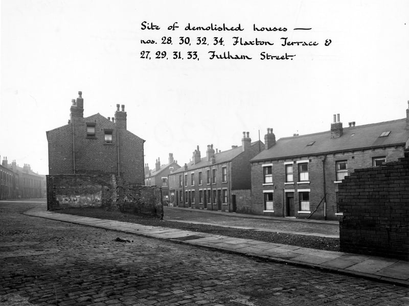 Fulham Street in foreground, showing site of demolished houses - numbers 28 - 34, Flaxton Terrace and numbers 27 - 33 Fulham Street. Remaining houses are visible. Pictured in October 1949.
