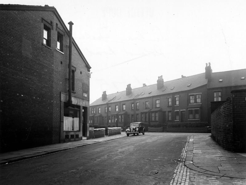 This view shows C. Parker's fish shop at number 49 Rowland Road by the junction with Sunbeam Terrace. The end of Sunbeam Avenue is visible. A car is parked at the end of the road. Pictured in September 1949.