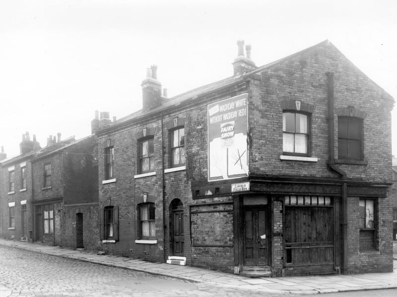 Lincoln Field Row from the junction with Cherry Row in October 1958 The shop at the end is numbered as 24 Cherry Row. Once a grocers, it is now bricked and boarded up as it awaits demolition. An advertisement for Fairy Snow occupies the side elevation. A faded sign above the frontage states that F. Grasby, Pawnbrokers was once there.